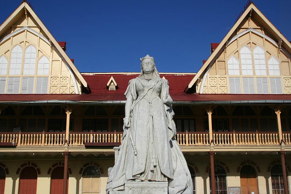 Courthouse in Georgetown, Guyana with a Statue of Queen Victoria