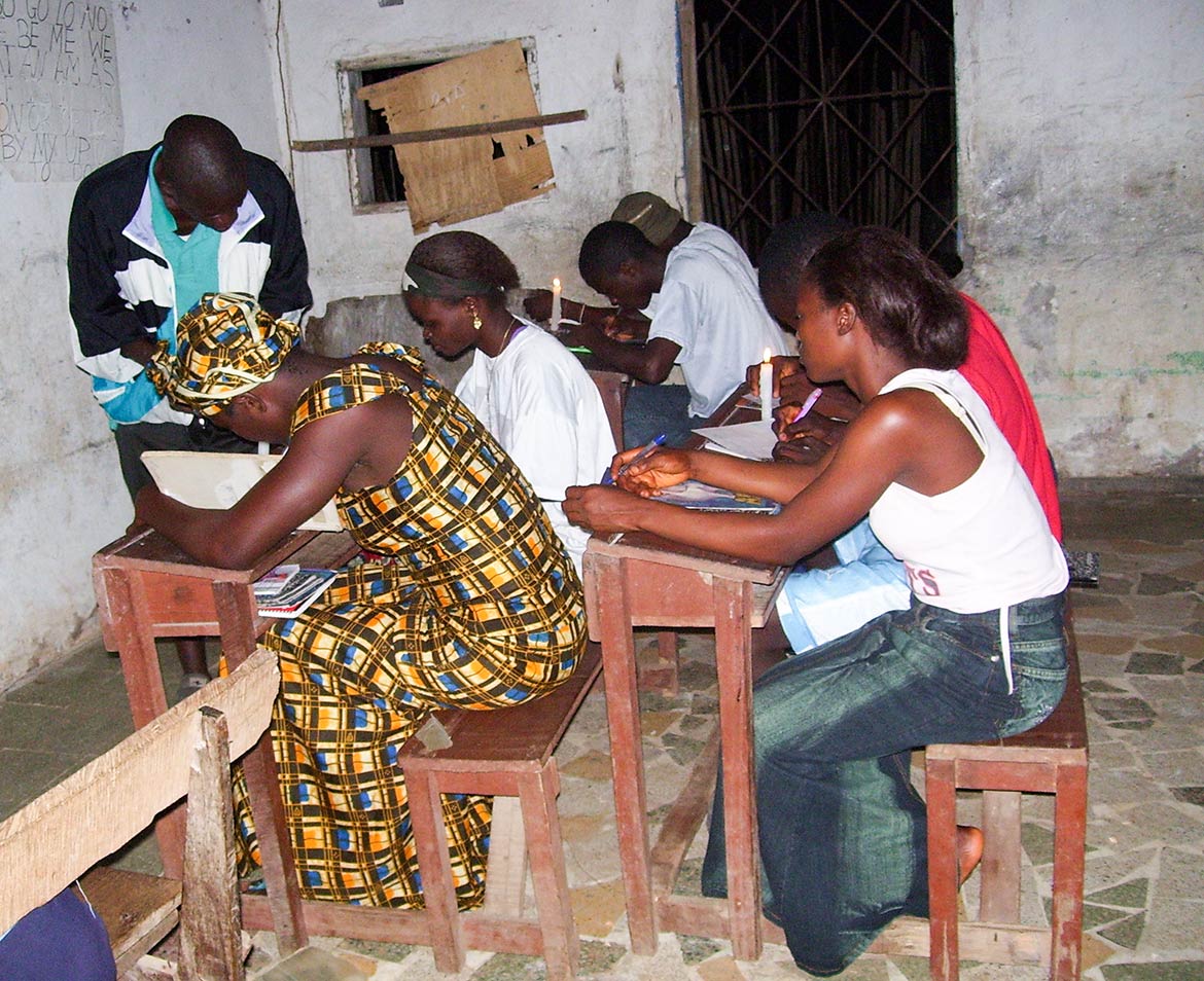Students studying by candlelight in Bong County in Liberia