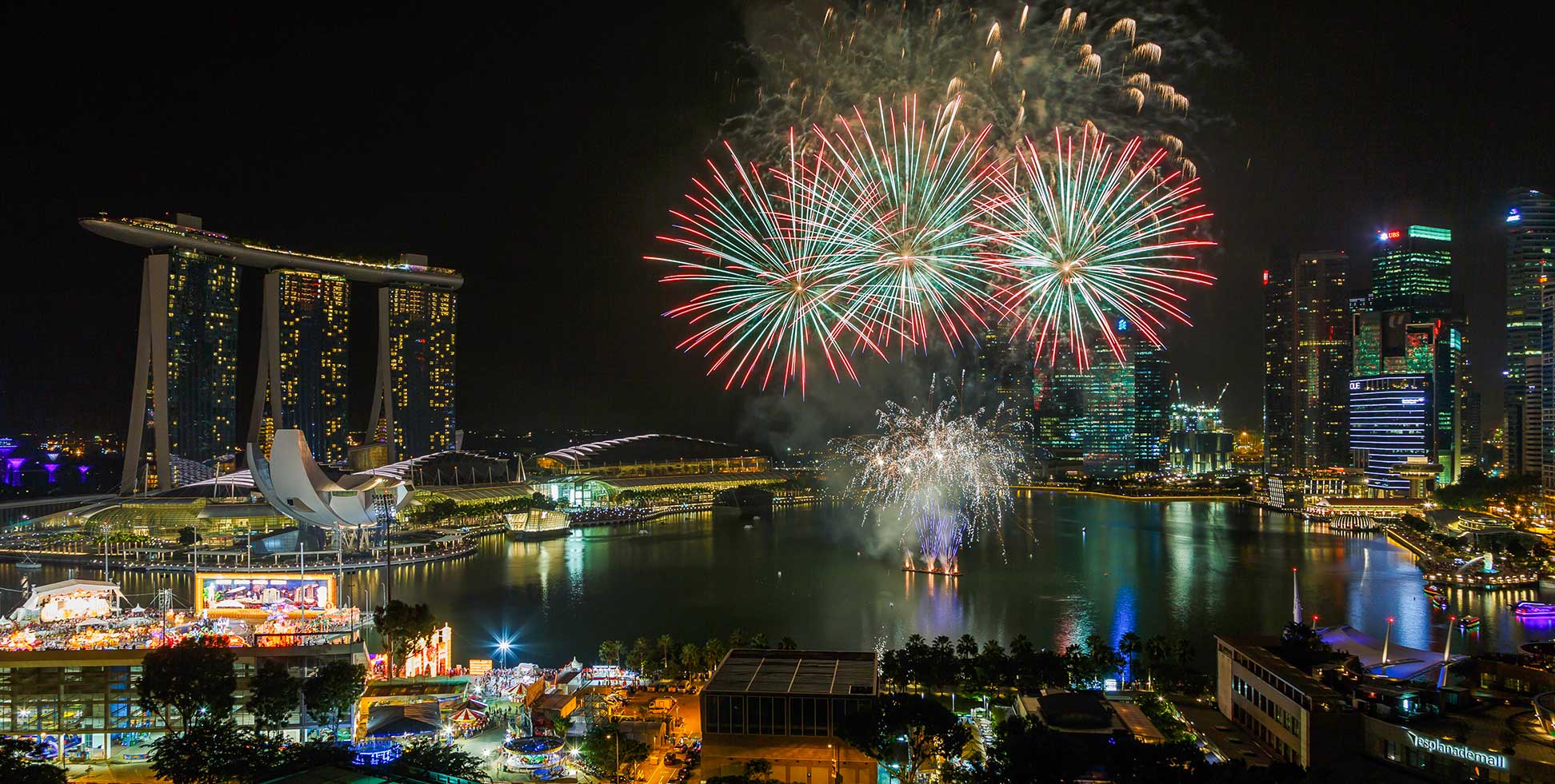 Firework display at midnight in Marina Bay of Singapore