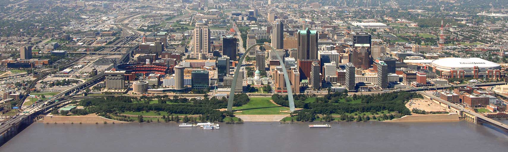 Aerial view of St. Louis Gateway Arch and St. Louis Central Business District on the riverbank of the Mississippi