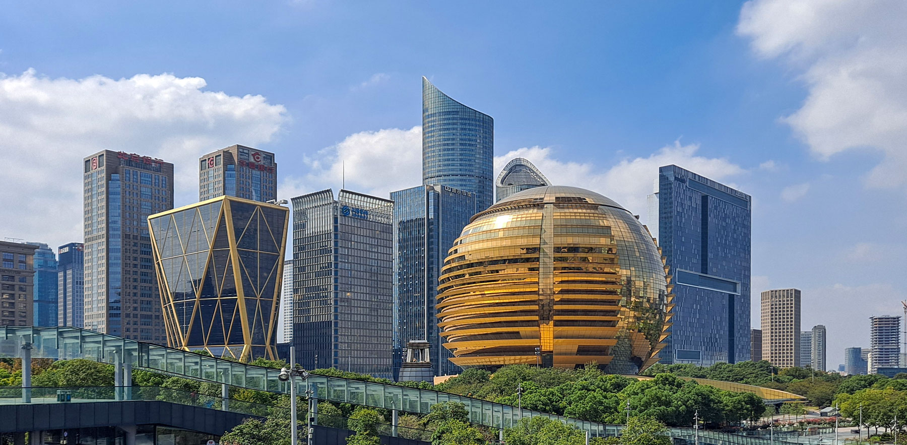Modern skyline of Hangzhou's Qianjiang New City financial district with the Hangzhou International Conference Center and skyscrapers along the Qiantang River in eastern China.