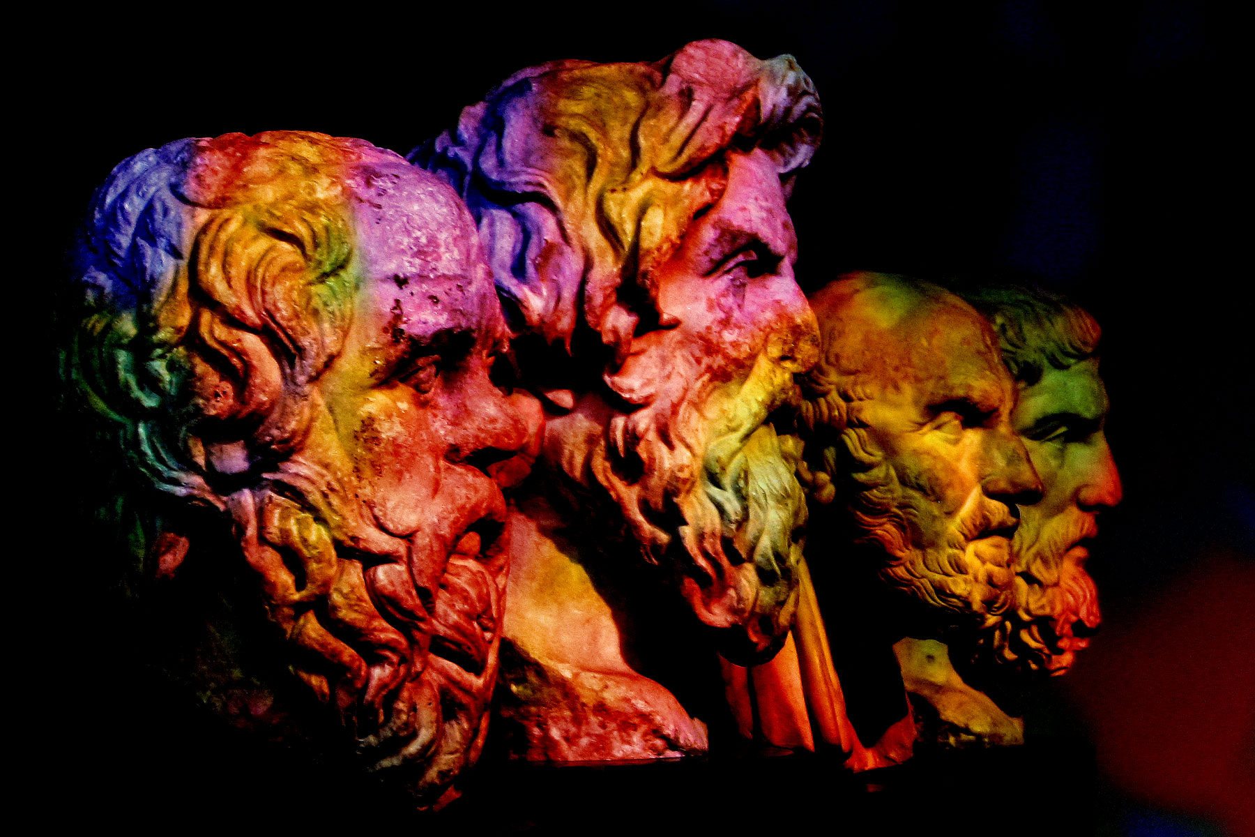 Carved busts of four ancient Greek philosophers: Socrates, Antisthenes, Chrysippus, and Epicurus.