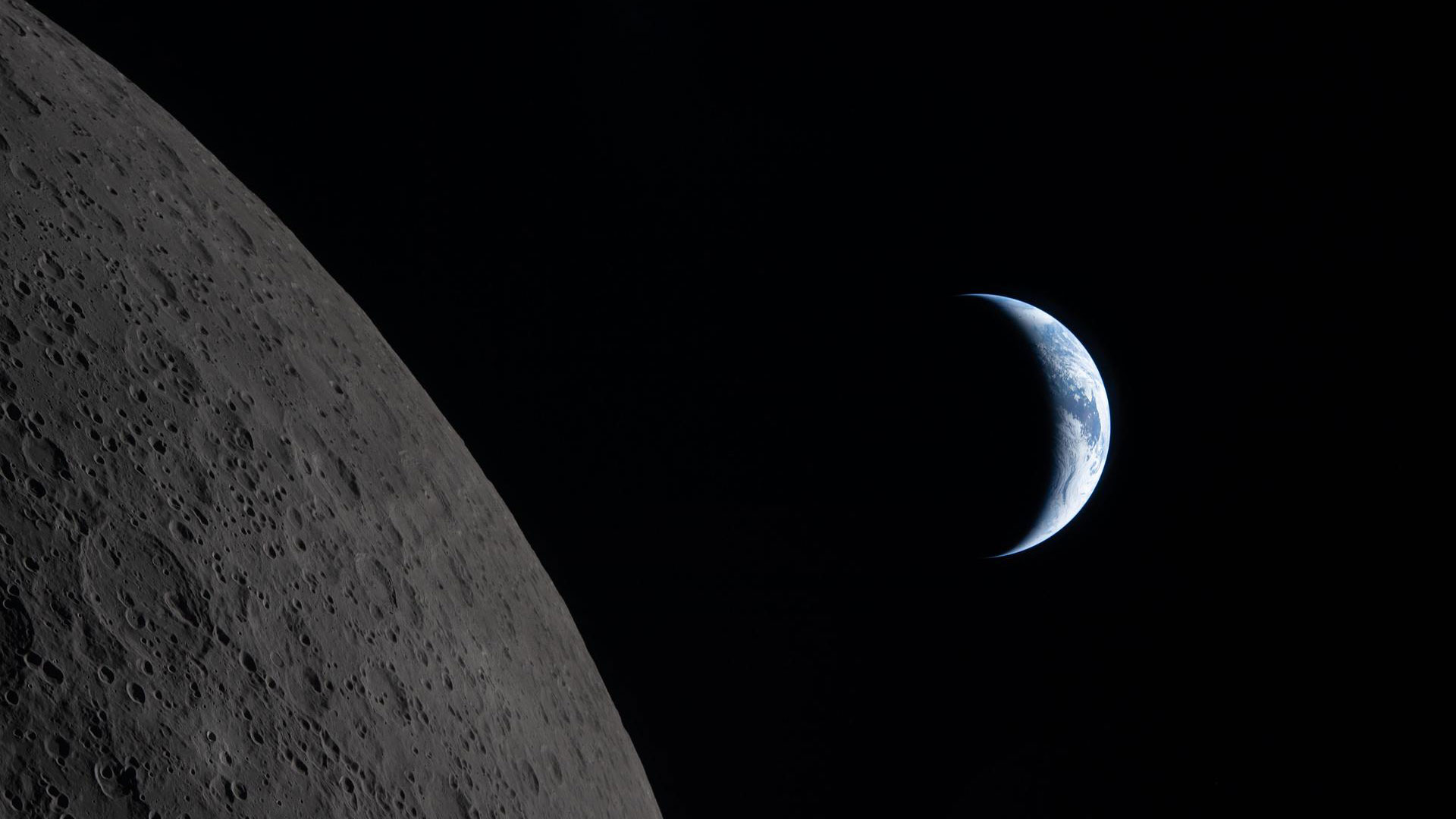 Picture of Earth behind the moon.
